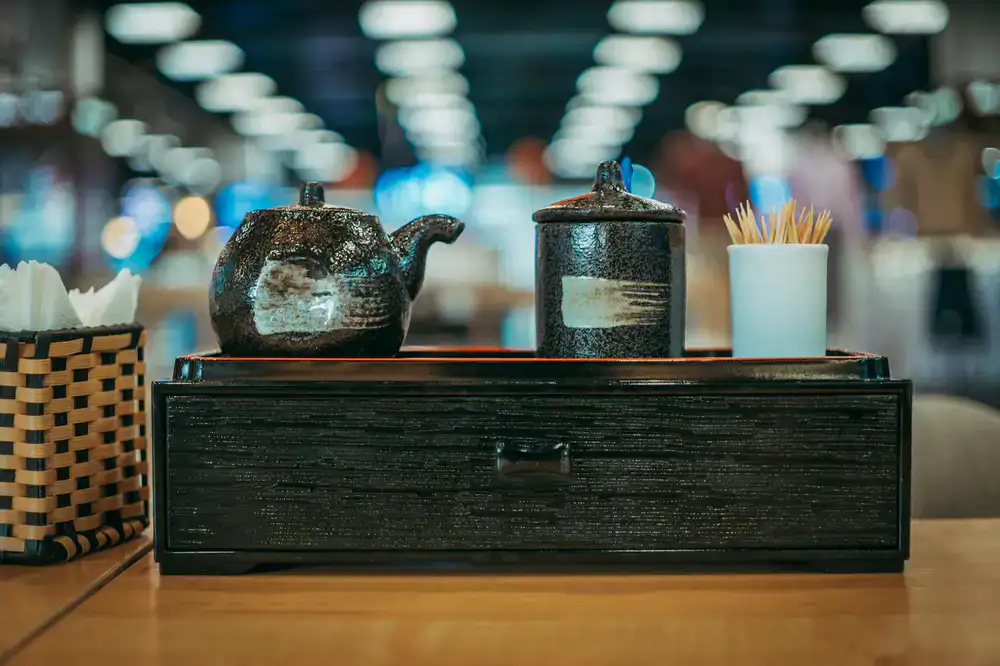 A complete tea service set arranged on a wooden table